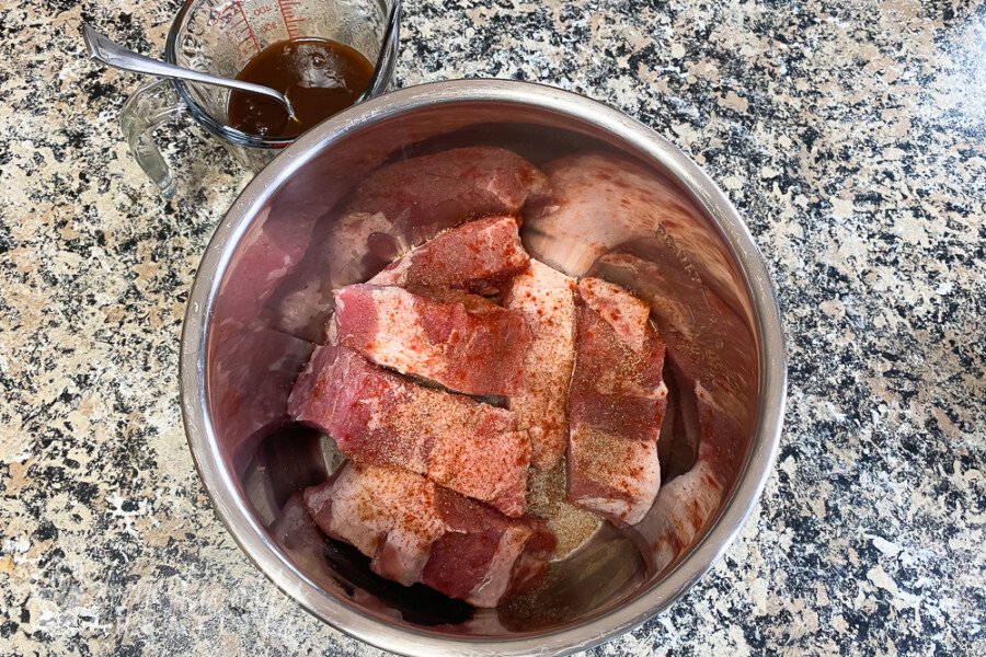 country style ribs with barbecue dry rub in bowl of instant pot