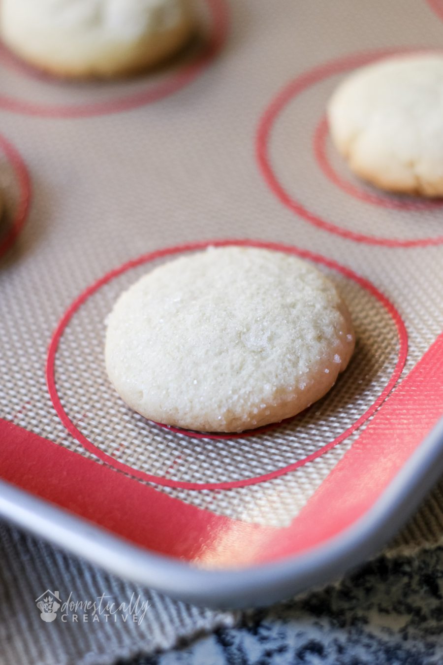 Close up freshly baked old fashioned sugar cookie on baking sheet