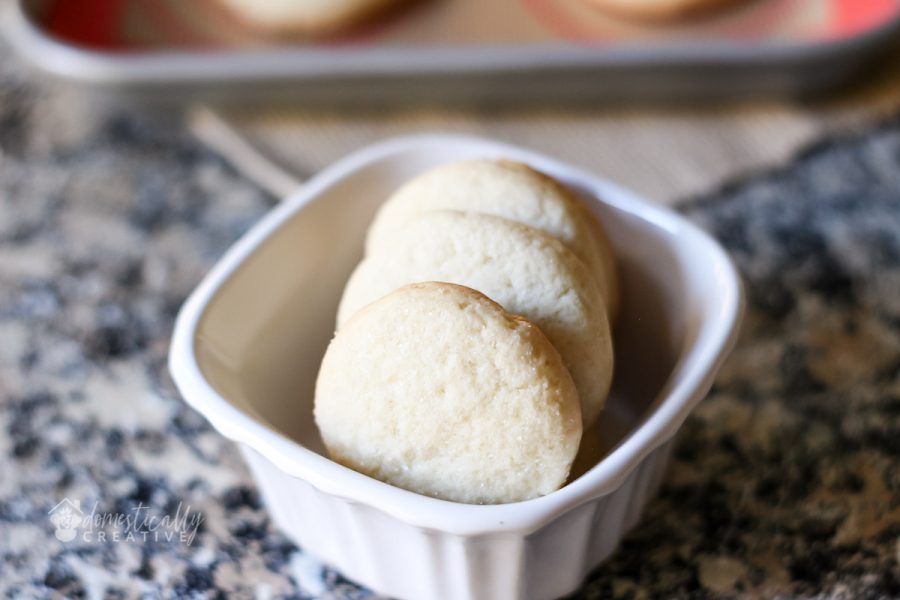 baked sugar cookies in small white container