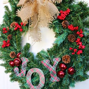 Such a fun and simple way to decorate your front door for Christmas with this Joy wreath