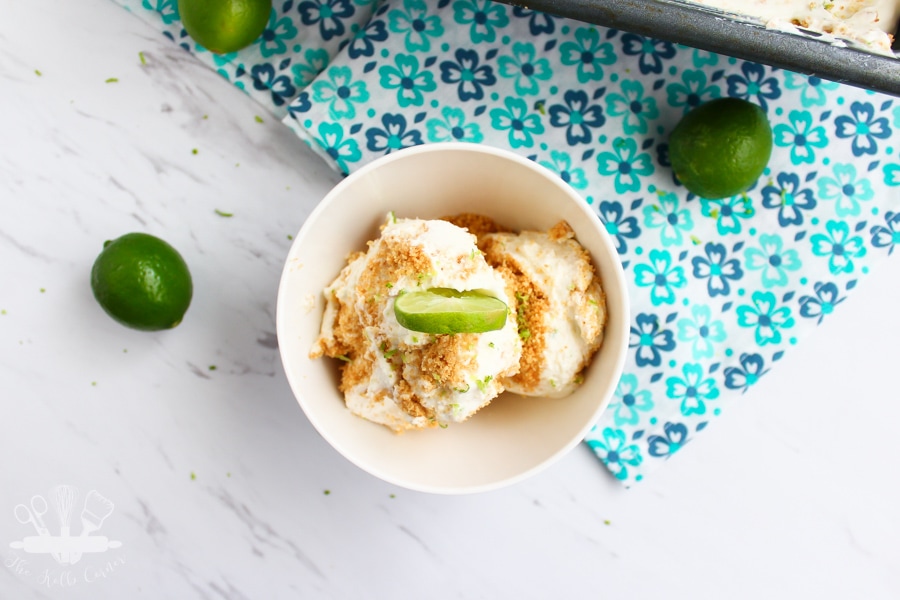 overhead view of key lime pie ice cream sprinkled with graham cracker crumbs and topped with a key lime