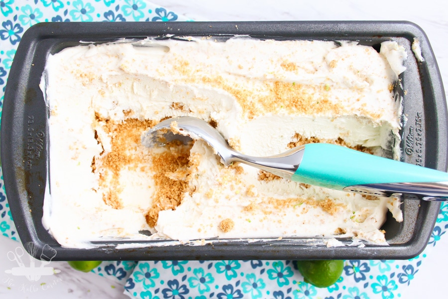 overhead view of key lime pie ice cream sprinkled with graham cracker crumbs and topped with a key lime