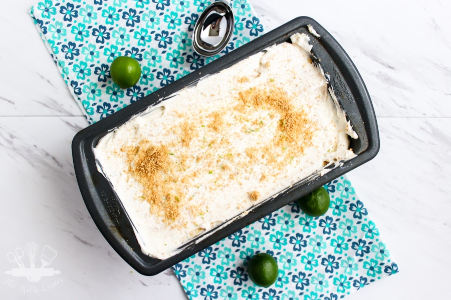 overhead view of key lime pie ice cream sprinkled with graham cracker crumbs and topped with a key lime
