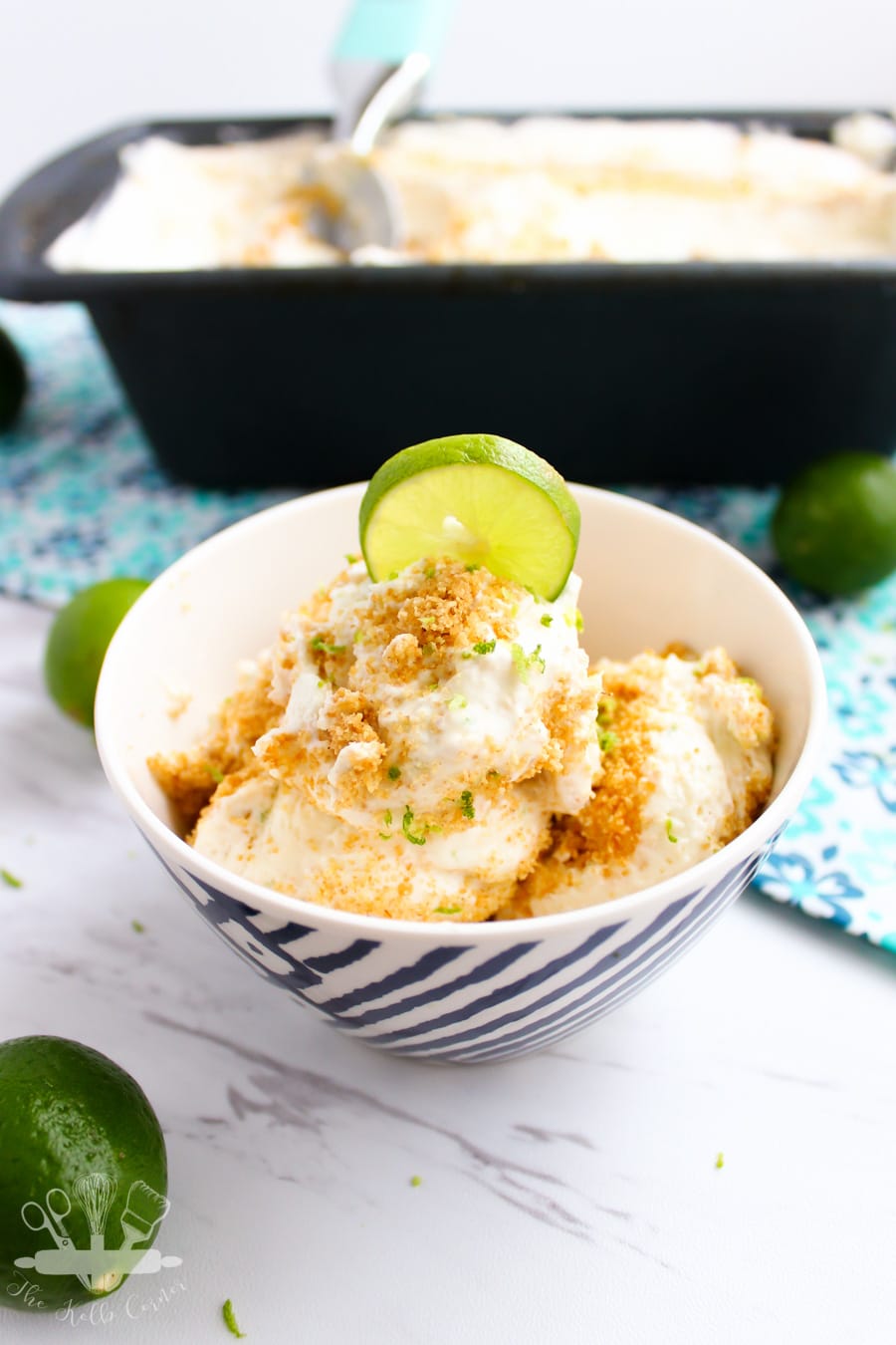 Close up of ice cream in a small bowl, with lime zest and graham cracker topping