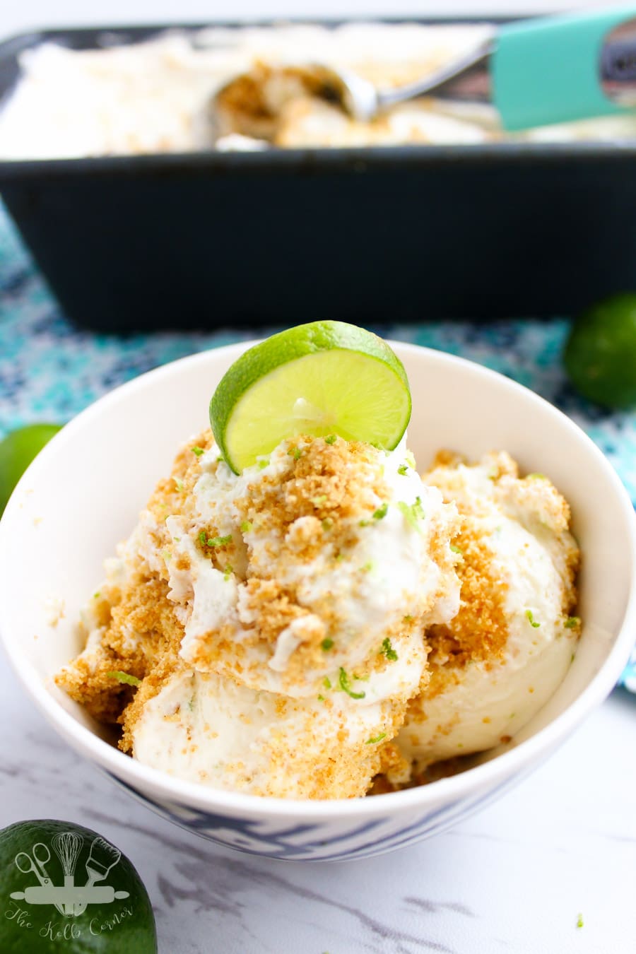 Close up of ice cream in a small bowl, with lime zest and graham cracker topping