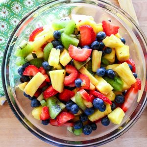 A rainbow blend of fruit, combined with a sweet and tart dressing makes this honey lime fruit salad a sure to be hit at any Summer cookout.