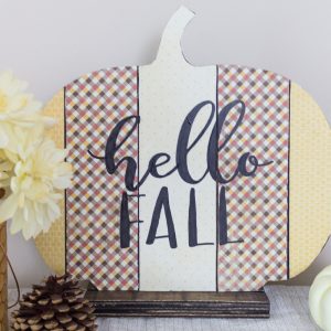 Make this simple scrapbook paper pumpkin Fall sign to welcome the season!