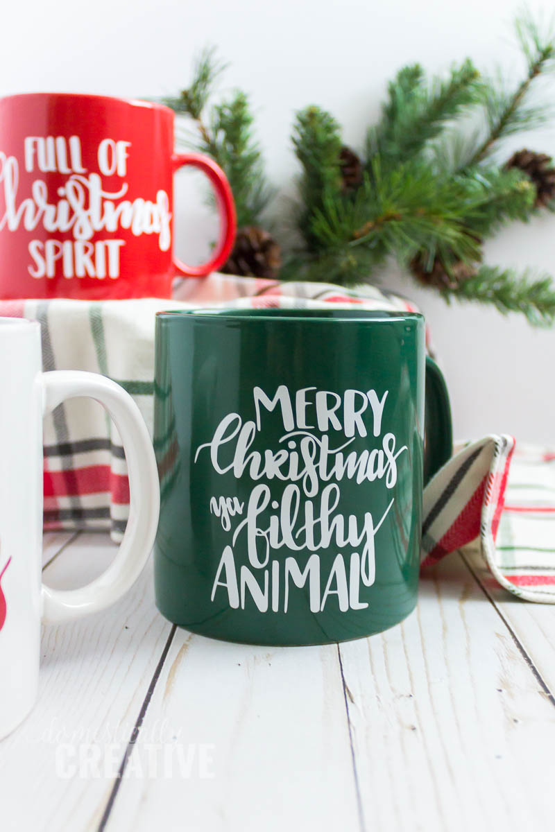 A quick and easy Christmas gift idea--hand lettered coffee mugs. Download your free cut files! #handletteredmug #christmasgift #christmascoffeemug #handletteredcoffeemug