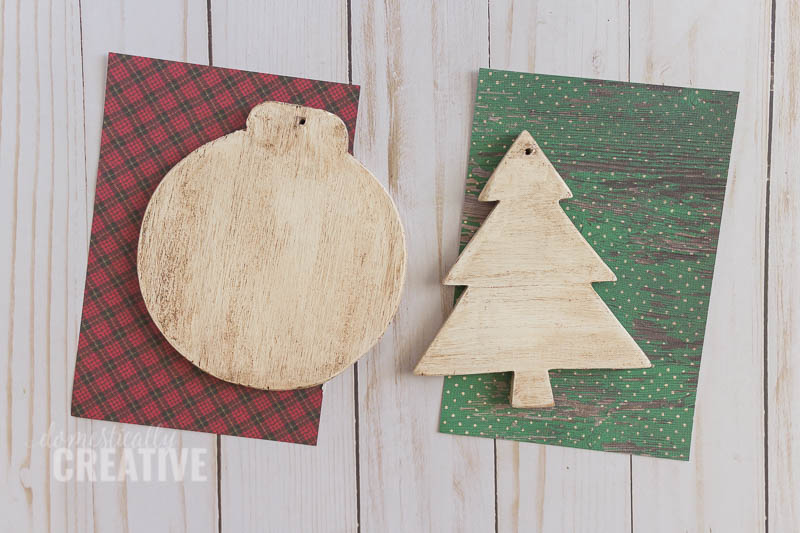 How cute would these Scrapbook paper Christmas ornaments look on the tree? #christmasornament #handmadeornament #christmas #scrapbookpaper #scrapbookpaperornament