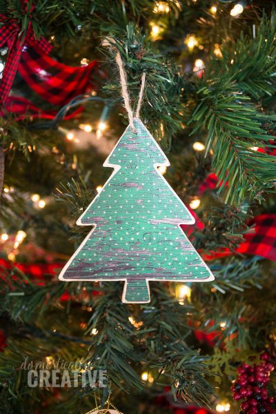 How cute would these Scrapbook paper Christmas ornaments look on the tree? #christmasornament #handmadeornament #christmas #scrapbookpaper #scrapbookpaperornament