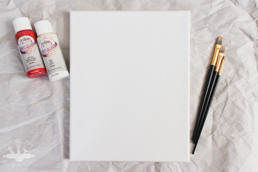 blank white canvas with paint brushes, red and white crafts paint on paper background