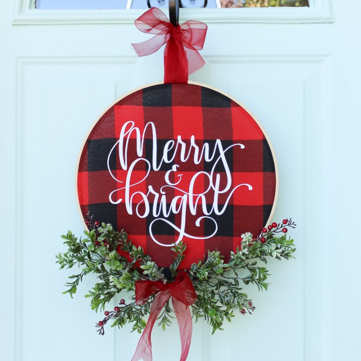 DIY Christmas Buffalo Check Hoop Wreath featuring fun Merry and Bright HTV
