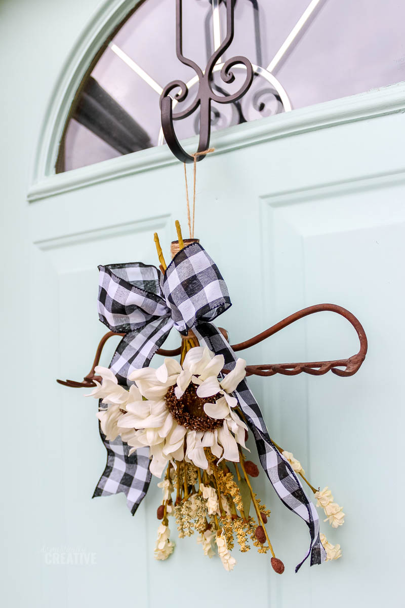 rake wreath hanging on the door from the side
