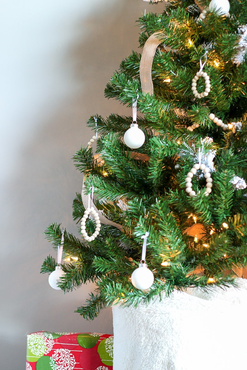 White glitter ball ornaments on christmas tree