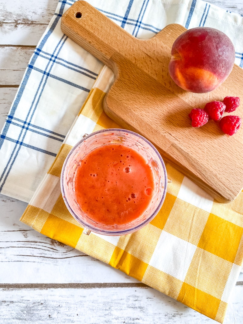 overhead of raspberry peach puree after blending