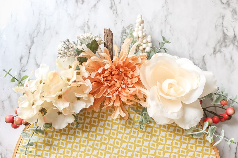 flower stems attached to hoop wreath