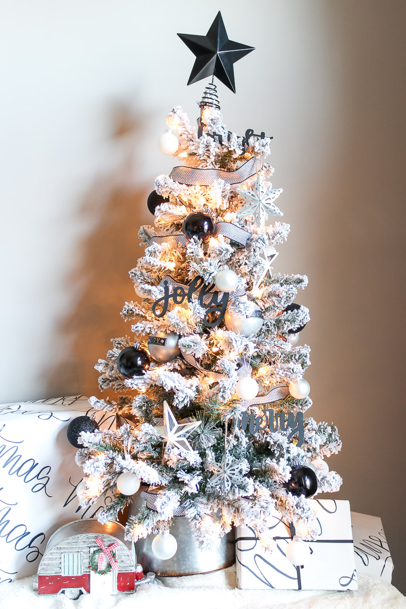 Overview of black and white decorated flocked Christmas tree