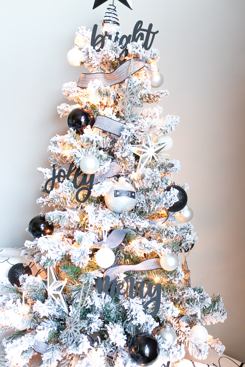 Overview of black and white decorated flocked Christmas tree