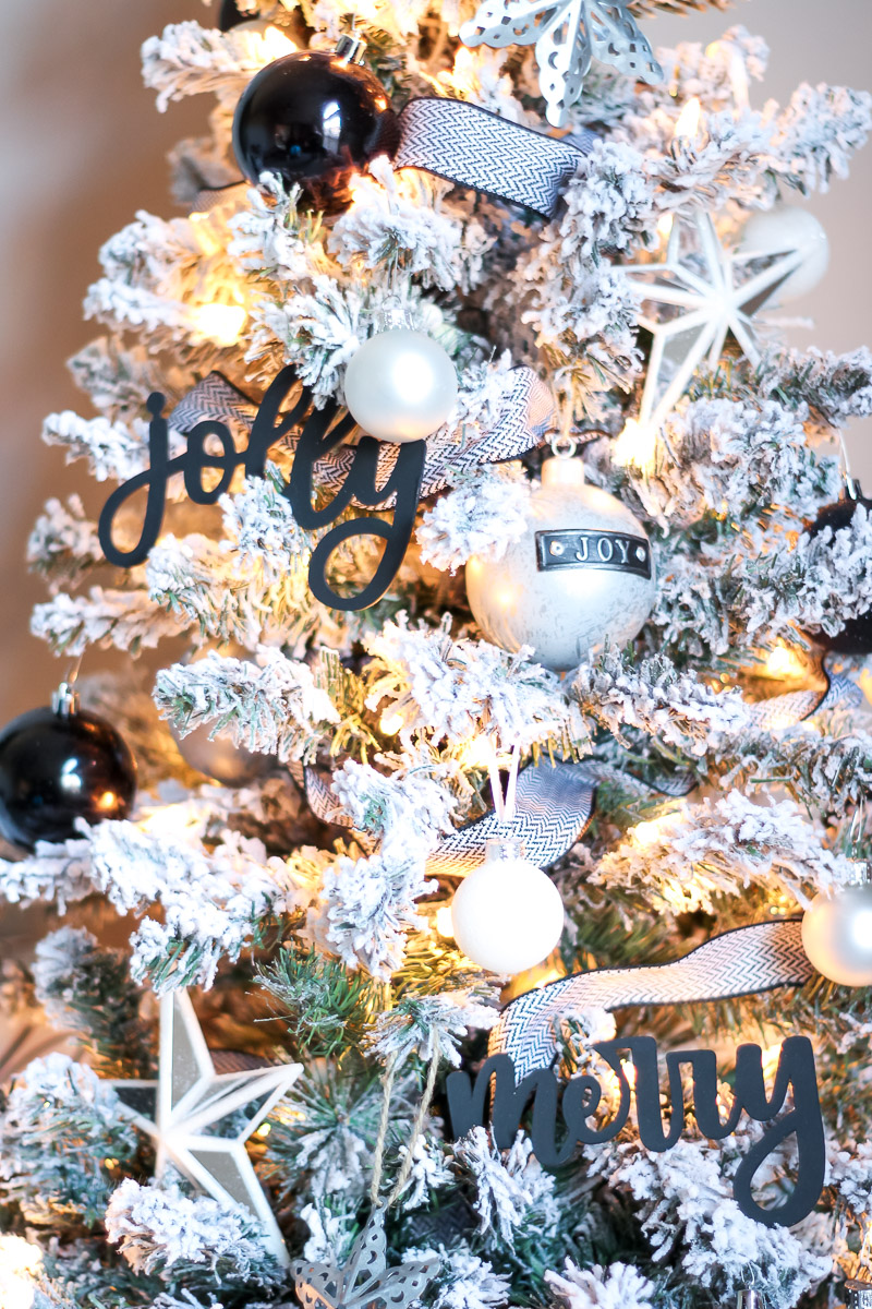 Black and white flocked Christmas tree decorated