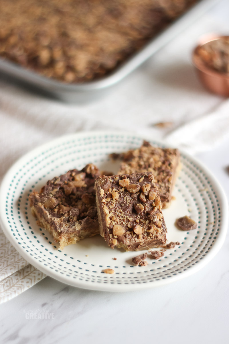 Close up toffee bars on small dessert plate