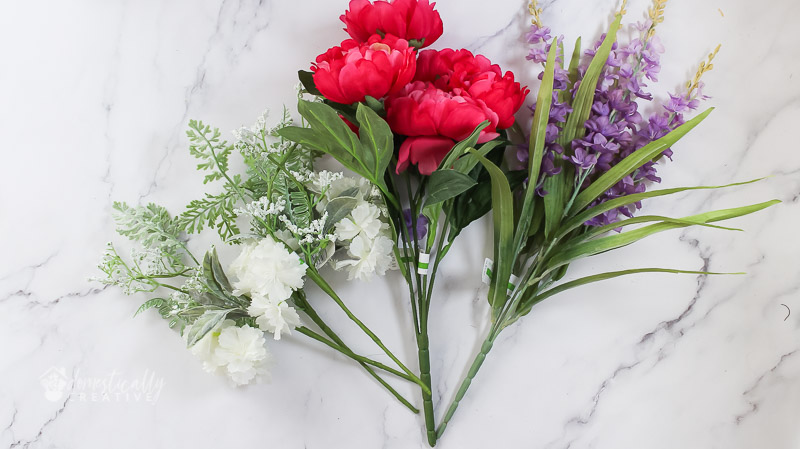 bunch of fake flowers on marble background