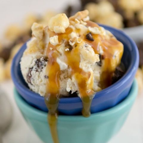 two bowls with caramel corn ice cream with drizzled caramel on top